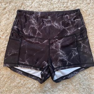 Buffbunny marble compression shorts with pockets.